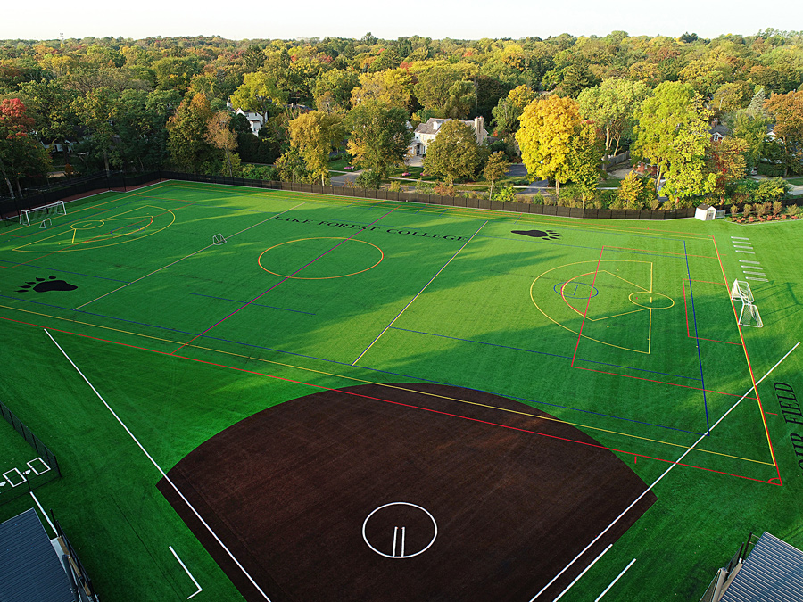 LFC-Mohr-DJI_0048edit Aerial view of a multi-sport field featuring soccer and baseball layouts, surrounded by trees and residential areas.