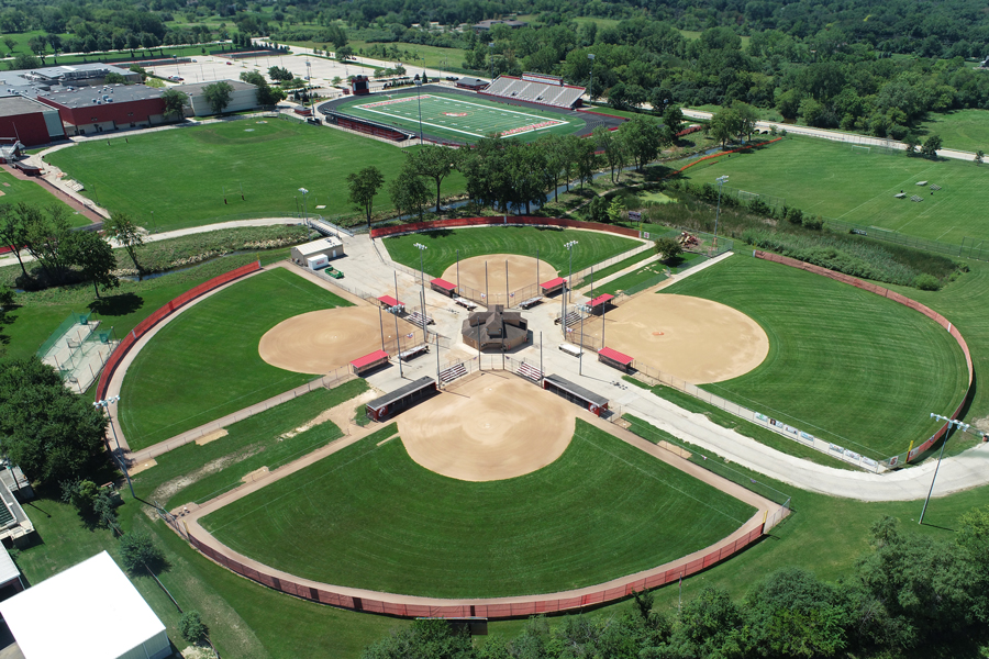 BarrHS-DJI_0014-web Aerial view of a multi-field baseball complex with well-maintained grass, surrounded by a track and other athletic facilities.