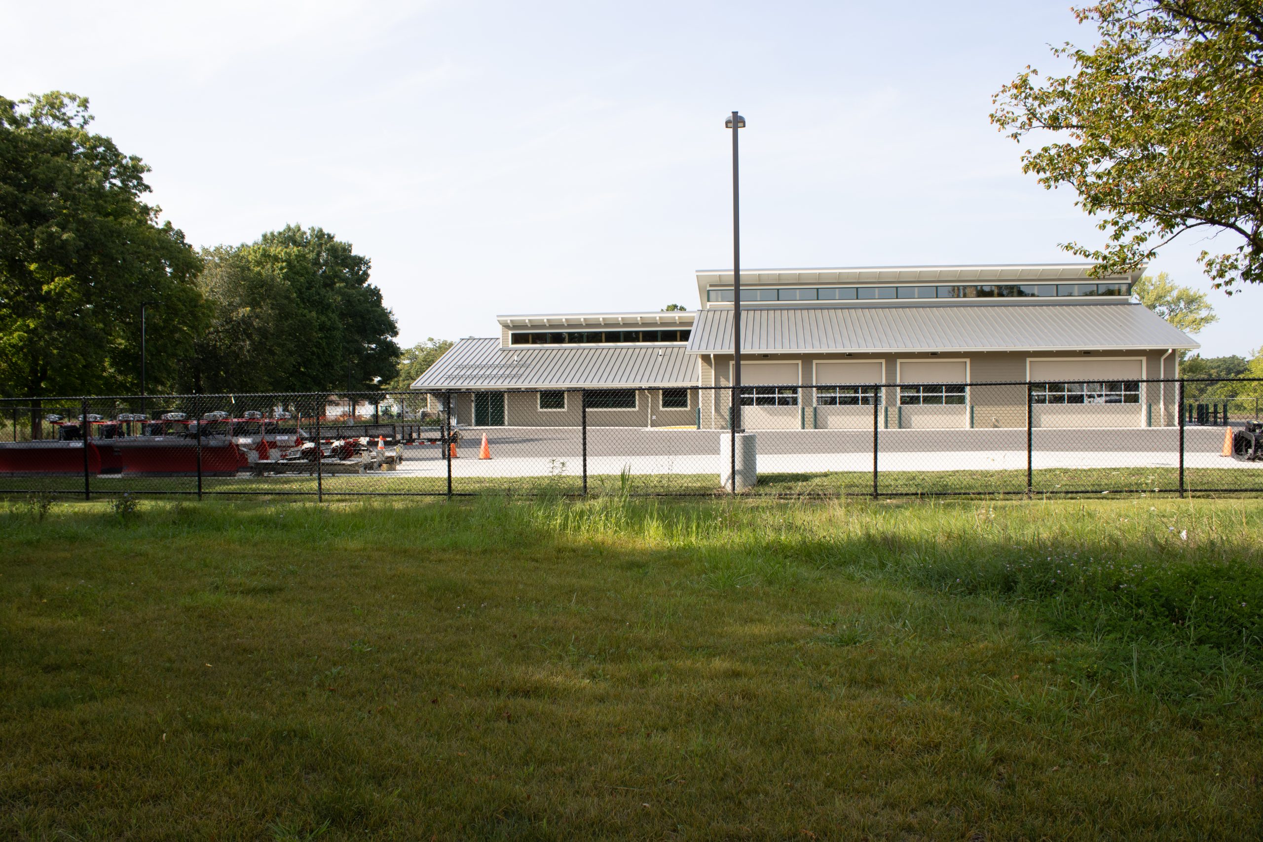 IMG_4874 Newly constructed municipal facility featuring a large, modern building with ample windows and landscaping in front.