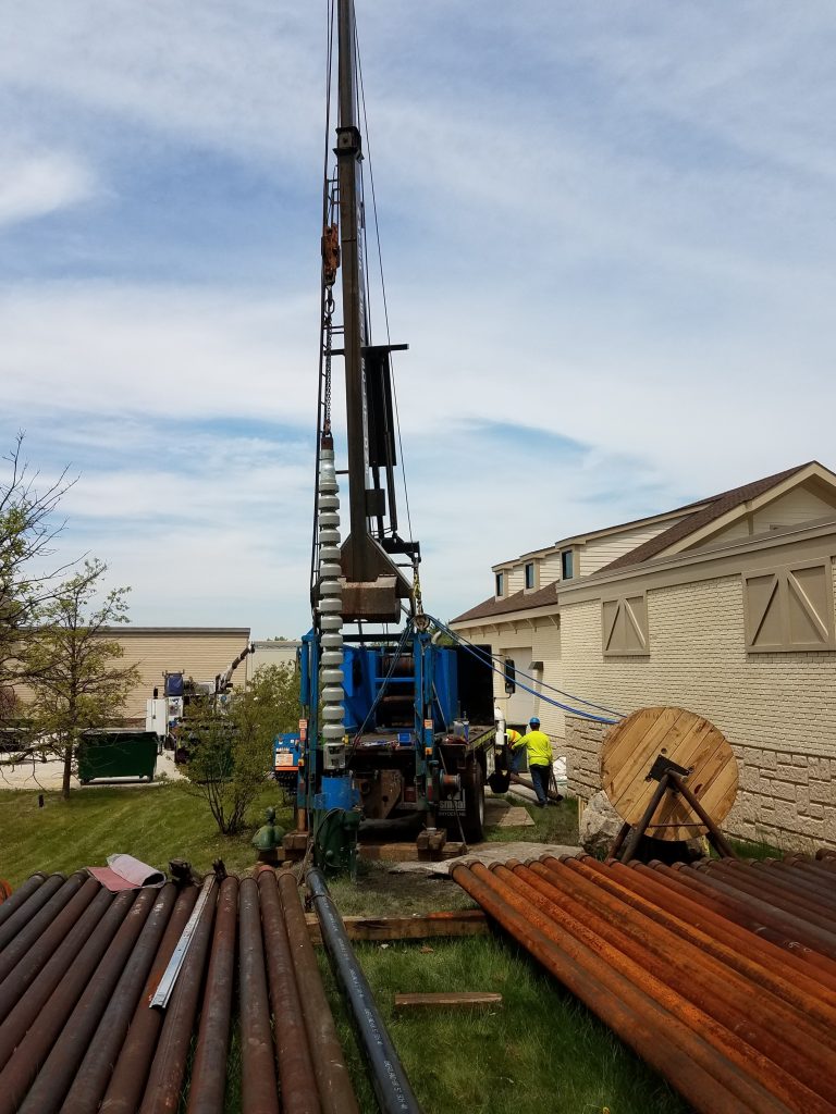 Motor and Pump Being Lowered into Casing