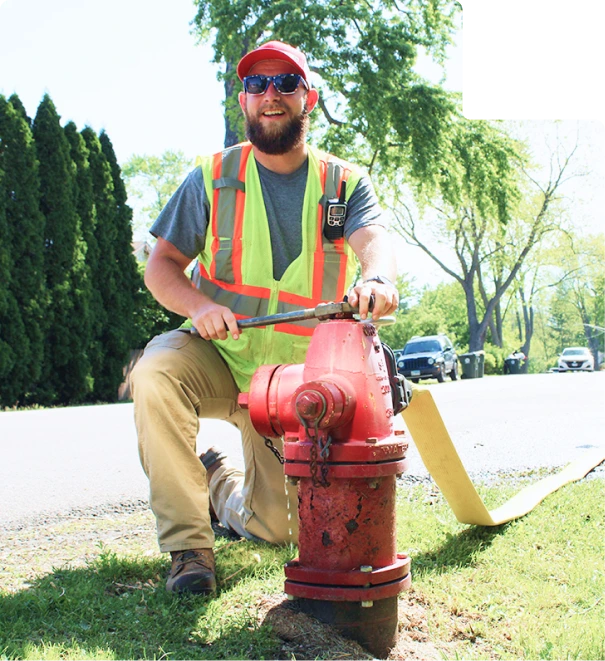 Man fixing fire hydrant with wrench-webp-92 (1)